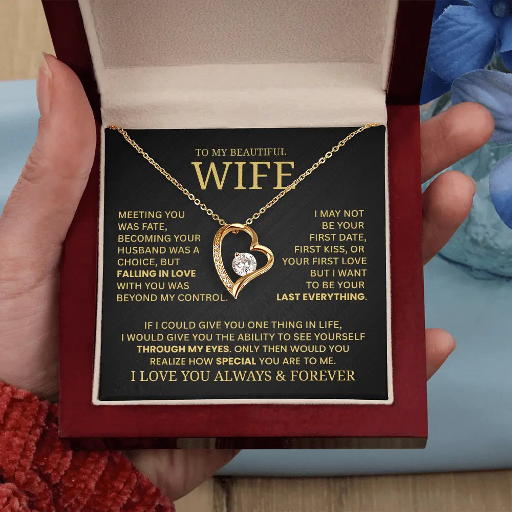 Gold necklace with heart design in a box with a message for a wife.